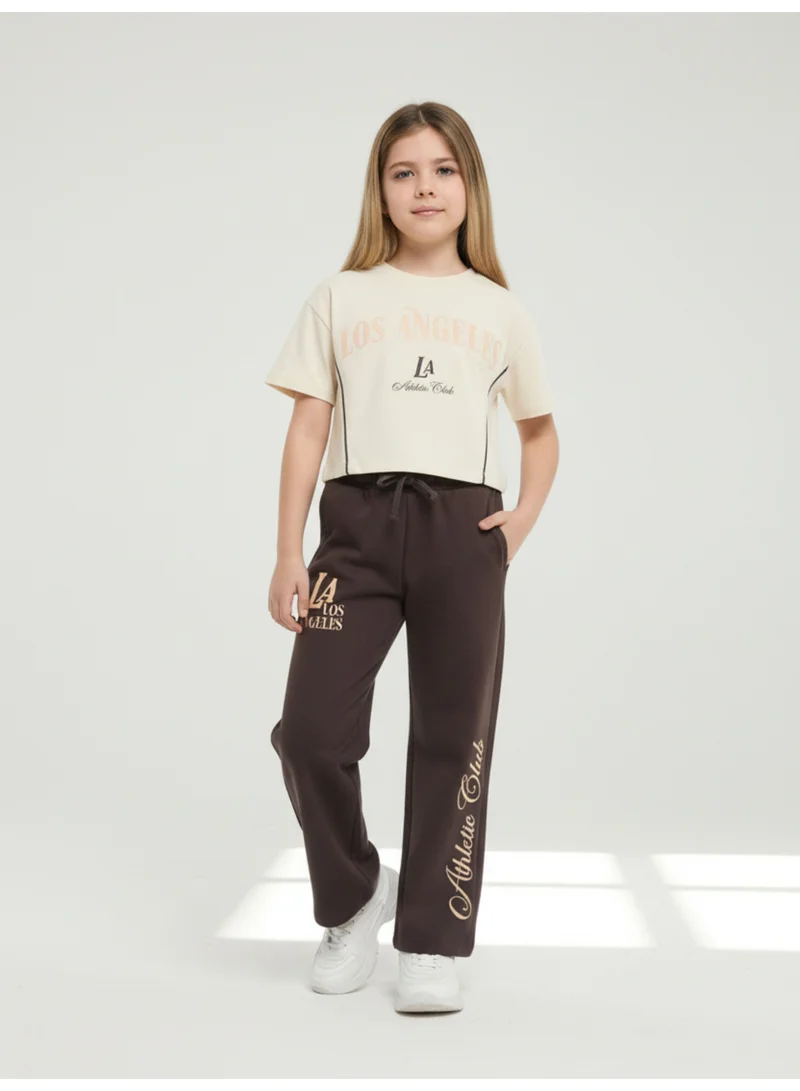 فكتور اند جين طقم بناتي قطعتين تي شيرت بطبعة لوس أنجلوس وبنطلون واسع - بيج وبني